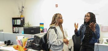 Two Students Talking on Office