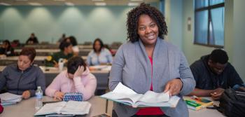 Senior Student with Book on Hands