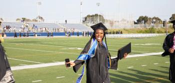 Happy Student at Field on Graduation