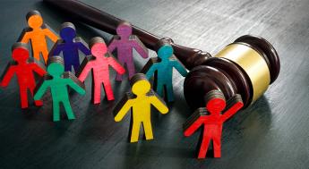 Figurines and gavel. Equality and social advocacy concept.