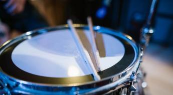 drum sticks resting on drum