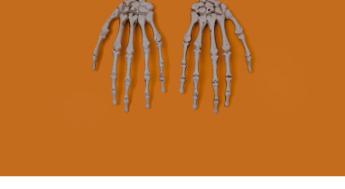 skeleton hands on orange background