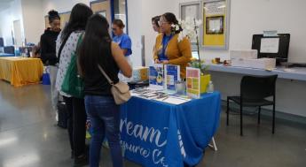 Dream Resource Center employees talk to students at event