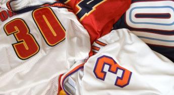 sports jerseys in a laundry pile