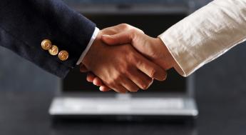 close up of two people shaking hands