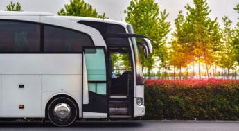 travel company bus greets tourists at the airport to take to the hotel