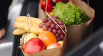 grocery bag of food filled with fruits and vegetables