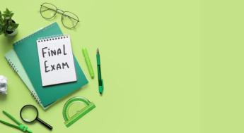 green notebook and background with final exam written on it. 