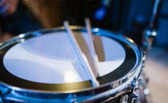 drum sticks resting on drum
