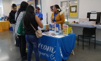 Dream Resource Center employees talk to students at event