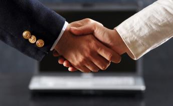 close up of two people shaking hands