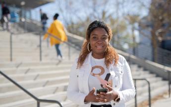 Student with Phone in LASC Stair