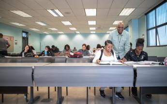 Professor with Students Explaining at Class