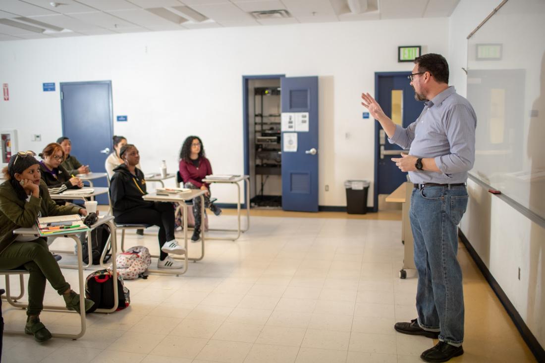 Man Teaching to Students in the Classroom