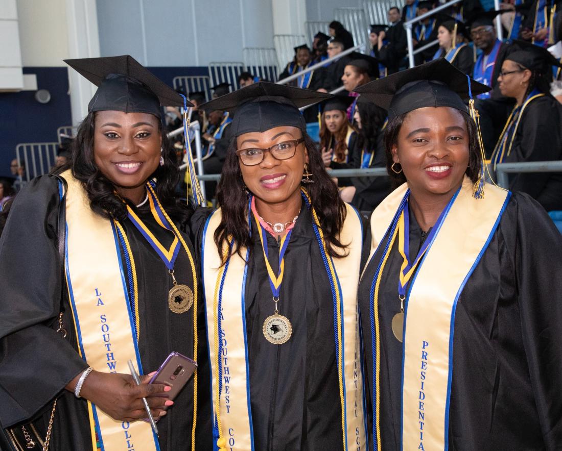Three Graduated Students Smiling