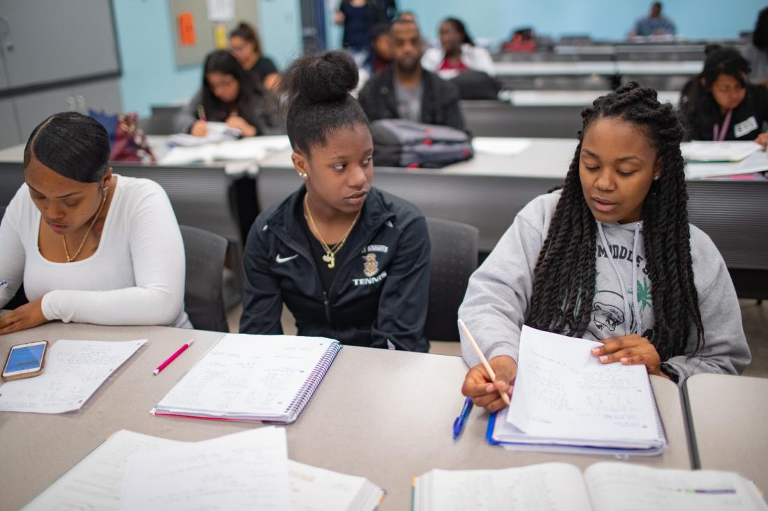 Girl Students taking Notes