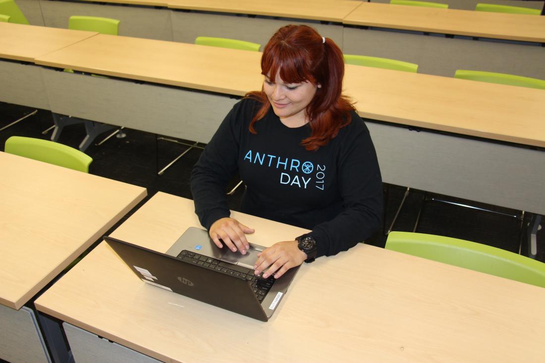 Student sitting with her computer