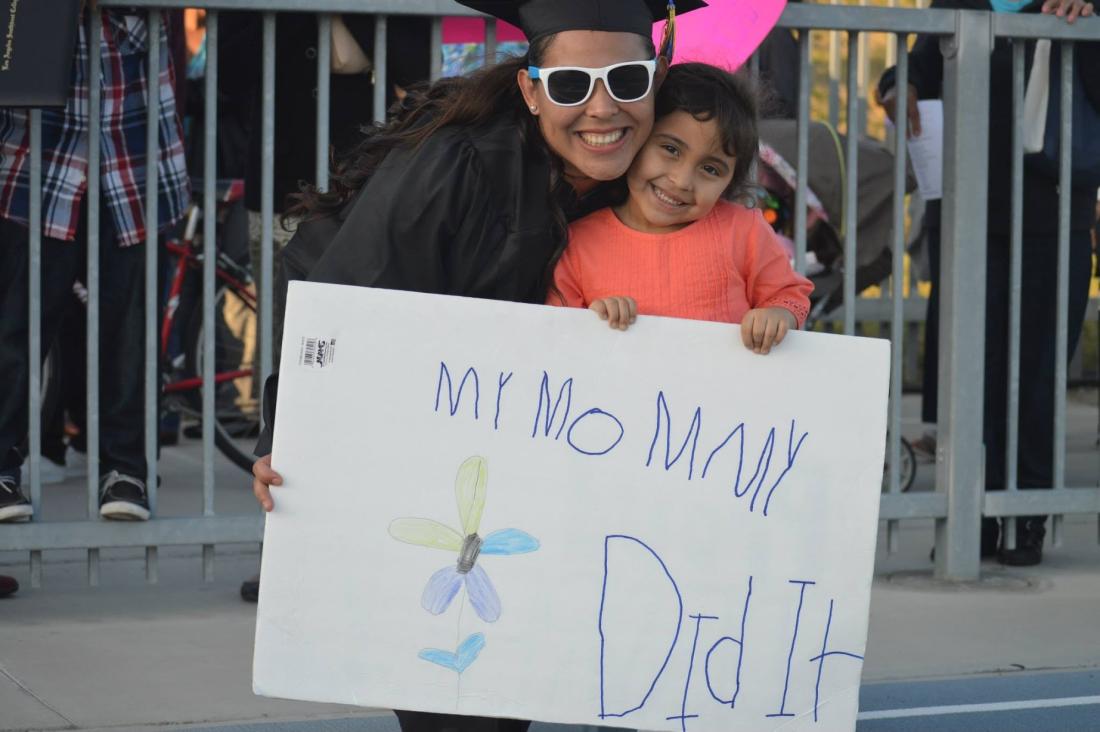 Graduated Mom Hugging her Daughter 