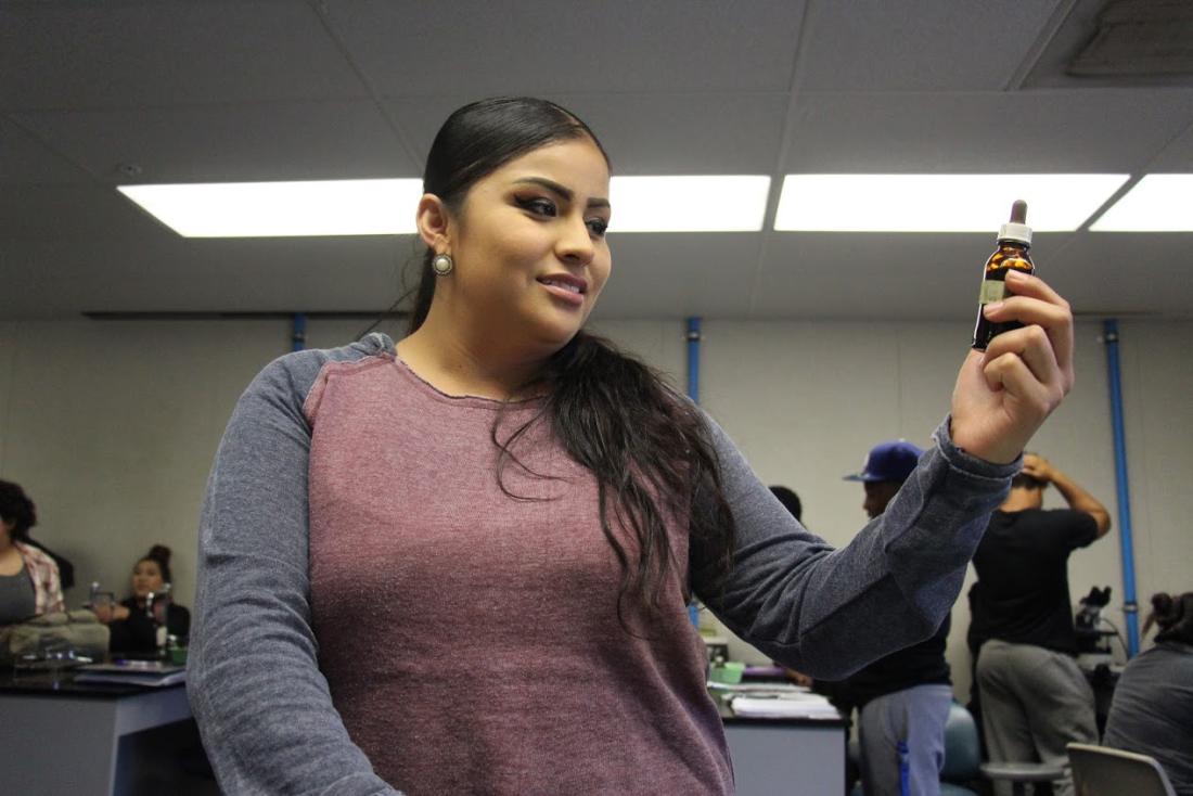 Student Analyzing a Small Container 