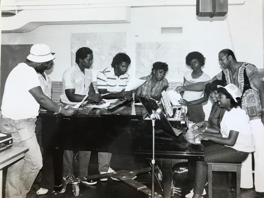 Happy Group of Singers Playing Piano