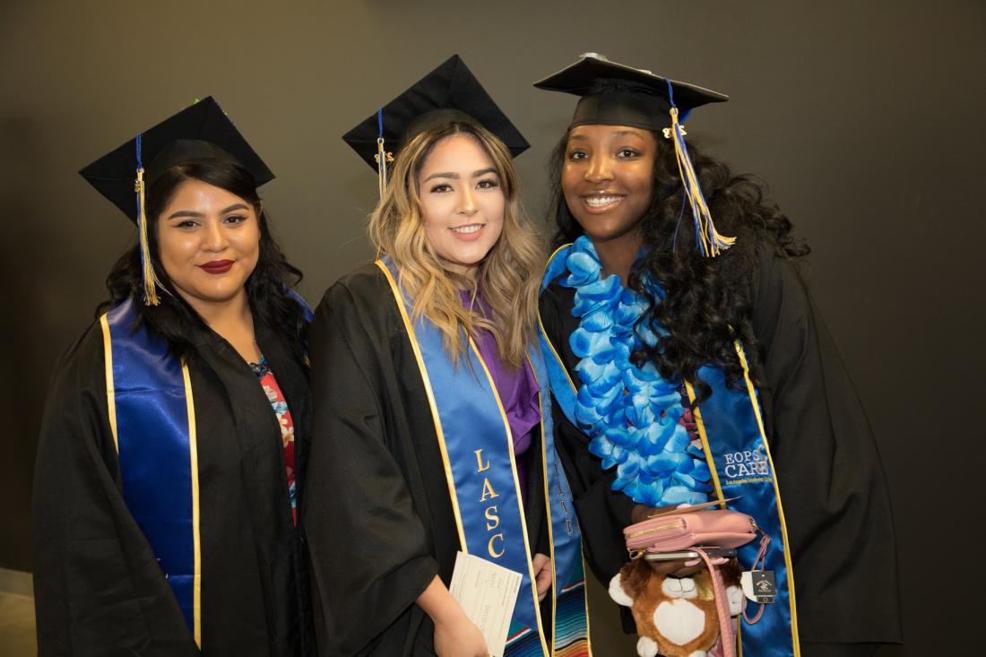 Women at Graduation Smiling for the Camera