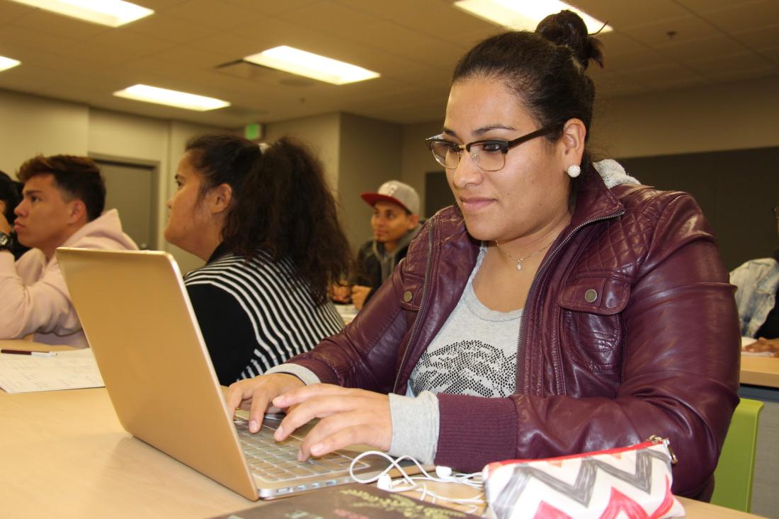 Student Using Laptop in Class