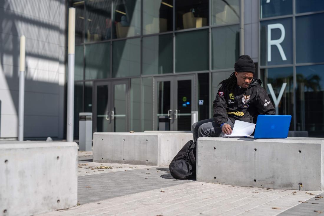 Student Outside in Computer