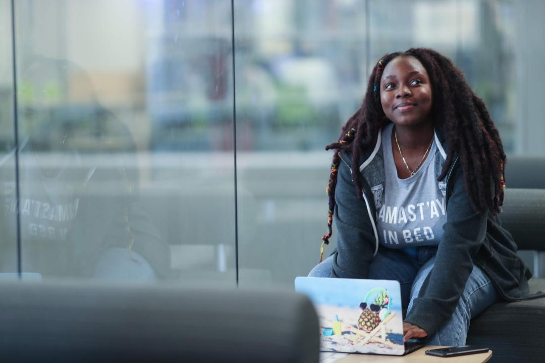 Student in Front of Window with Computer