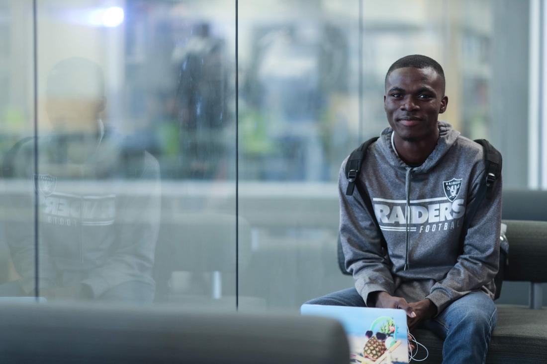 Student Sitting with Computer