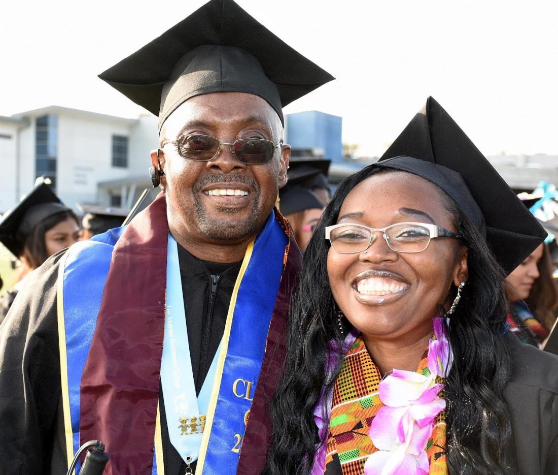 Two Students Smiling at Graduation Event