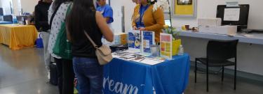 Dream Resource Center employees talk to students at event