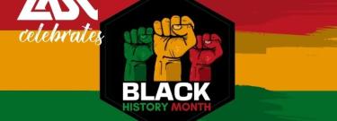 red, yellow, and green stripes behind black octagon with fists in same colors